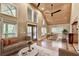 Open concept living room featuring hardwood floors and access to the porch at 975 Timber Lake Trl, Cumming, GA 30041