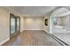 Spacious living room boasts hardwood floors, and a doorway into the luxurious bathroom at 975 Timber Lake Trl, Cumming, GA 30041