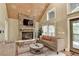 Cozy living room featuring a stone fireplace and hardwood floors at 975 Timber Lake Trl, Cumming, GA 30041