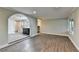 Spacious living room boasts hardwood floors, and a large picture window for an airy and inviting space at 975 Timber Lake Trl, Cumming, GA 30041