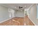 Spacious living room with hardwood floors, fresh neutral paint and modern ceiling fan at 975 Timber Lake Trl, Cumming, GA 30041