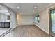 Spacious living room boasts hardwood floors, and a large picture window for an airy and inviting space at 975 Timber Lake Trl, Cumming, GA 30041