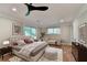Comfortable main bedroom featuring hardwood floors and a sitting area at 975 Timber Lake Trl, Cumming, GA 30041