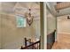 Elegant stairway features a decorative chandelier, natural light and rich wood railing at 975 Timber Lake Trl, Cumming, GA 30041