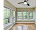 Sunroom with lots of windows and a ceiling fan at 975 Timber Lake Trl, Cumming, GA 30041