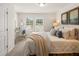 Bright bedroom with large windows, neutral decor, and a cozy throw blanket at 1337 Magnolia Bend Way # 289, Jonesboro, GA 30238