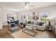Open-concept living room and dining area featuring hardwood floors and plenty of natural light at 1337 Magnolia Bend Way # 289, Jonesboro, GA 30238