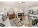 Open concept living room with modern furnishings and stainless steel kitchen appliances at 1337 Magnolia Bend Way # 289, Jonesboro, GA 30238