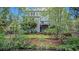 Spacious backyard with a grassy area, black fence, and multi-story home at 1420 Cortez Ne Ln, Atlanta, GA 30319