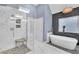 Modern bathroom featuring a freestanding tub, glass shower with stone accents, and a contemporary design at 1420 Cortez Ne Ln, Atlanta, GA 30319