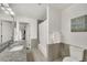 Neutral bathroom features granite counters, shower/tub combo, and decorative wall art at 1420 Cortez Ne Ln, Atlanta, GA 30319