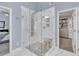 Luxurious glass shower with stone accents and bench seating is a showstopper in the contemporary bathroom at 1420 Cortez Ne Ln, Atlanta, GA 30319