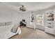 Bright bedroom with built-in bookshelves and a comfortable workspace near a window at 1420 Cortez Ne Ln, Atlanta, GA 30319