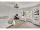 Bright bedroom with built-in bookshelves, a ceiling fan, and large windows at 1420 Cortez Ne Ln, Atlanta, GA 30319