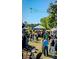 Lively outdoor event in Brookhaven featuring tents, crowds, and a beautiful green space at 1420 Cortez Ne Ln, Atlanta, GA 30319