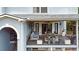 Upper-level deck featuring comfortable seating and a peaceful view of the backyard at 1420 Cortez Ne Ln, Atlanta, GA 30319