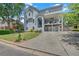 Charming three-story home with a manicured lawn, driveway and a two car garage at 1420 Cortez Ne Ln, Atlanta, GA 30319
