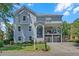 Charming two-story home boasts a unique architectural style, and manicured landscaping at 1420 Cortez Ne Ln, Atlanta, GA 30319