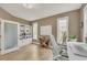 Home office features built-in shelving, a frosted glass door, and lots of natural light at 1420 Cortez Ne Ln, Atlanta, GA 30319