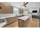 Modern kitchen features stainless steel appliances, a center island, and granite countertops at 1420 Cortez Ne Ln, Atlanta, GA 30319