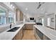Open kitchen boasts stainless appliances, an island with seating, and plenty of counter space at 1420 Cortez Ne Ln, Atlanta, GA 30319