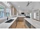 Modern kitchen featuring an island, stainless steel appliances, white countertops, and an open layout at 1420 Cortez Ne Ln, Atlanta, GA 30319