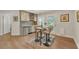 Stylish kitchenette with mosaic backsplash, stainless steel fridge, and bar seating at 1420 Cortez Ne Ln, Atlanta, GA 30319