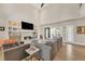 Sun-filled living room with a fireplace, built-in shelving, and access to a relaxing outdoor space at 1420 Cortez Ne Ln, Atlanta, GA 30319