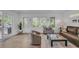 Bright living area with a sliding door, hardwood floors and large windows offering plenty of natural light at 1420 Cortez Ne Ln, Atlanta, GA 30319