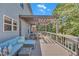 Spacious outdoor deck with wooden pergola, comfortable seating, and dining area at 1420 Cortez Ne Ln, Atlanta, GA 30319