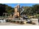 Elaborate playground features a tall wooden tower, winding slides, and swings for endless fun at 1420 Cortez Ne Ln, Atlanta, GA 30319