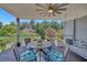 Covered porch with ceiling fan and comfortable seating, providing a relaxing space to enjoy the outdoors at 1420 Cortez Ne Ln, Atlanta, GA 30319