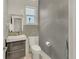 Chic powder room featuring a modern sink, mosaic tile accent wall, and contemporary design at 1420 Cortez Ne Ln, Atlanta, GA 30319