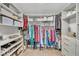 Spacious walk-in closet with custom shelving, hanging rods, and ample storage for shoes and clothing at 1420 Cortez Ne Ln, Atlanta, GA 30319