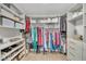 Spacious walk-in closet with custom shelving, shoe racks, and abundant storage solutions at 1420 Cortez Ne Ln, Atlanta, GA 30319