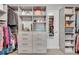 Organized walk-in closet with ample storage, built-in shelves, and hanging space at 1420 Cortez Ne Ln, Atlanta, GA 30319