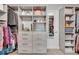 Well-organized walk-in closet with custom shelving and ample storage space for clothes and accessories at 1420 Cortez Ne Ln, Atlanta, GA 30319