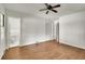 Bedroom featuring hardwood floors, ceiling fan, and views into the attached bathroom at 2167 Tanglewood Rd, Decatur, GA 30033