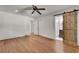 Bedroom featuring hardwood floors, ceiling fan, closet, and view into adjacent bathroom at 2167 Tanglewood Rd, Decatur, GA 30033