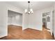 Spacious dining room featuring hardwood floors and an open doorway to the kitchen at 2167 Tanglewood Rd, Decatur, GA 30033