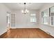 Cozy dining area featuring beautiful hardwood floors, freshly painted white walls, and ample natural light at 2167 Tanglewood Rd, Decatur, GA 30033