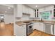 Well-lit kitchen with stainless steel appliances and white subway tile backsplash at 2167 Tanglewood Rd, Decatur, GA 30033