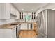 Updated kitchen with stainless steel appliances, granite countertops, and white cabinets at 2167 Tanglewood Rd, Decatur, GA 30033