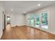 Inviting living room featuring hardwood floors and French doors to the backyard at 2167 Tanglewood Rd, Decatur, GA 30033