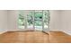 Bright room with wood floors, white walls, and French doors leading to landscaped yard at 2167 Tanglewood Rd, Decatur, GA 30033