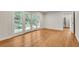 Bright living room featuring hardwood floors, white walls, and french doors to the back yard at 2167 Tanglewood Rd, Decatur, GA 30033