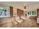 Cozy sunroom with brick accents, lots of natural light, and wood-look floors at 2167 Tanglewood Rd, Decatur, GA 30033