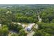 An aerial view of modern townhomes surrounded by lush greenery and a well-maintained parking area at 2202 Carlton Ct # 7, Atlanta, GA 30318