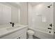 Well-lit bathroom featuring a tub-shower combo, quartz vanity, and modern fixtures at 2202 Carlton Ct # 7, Atlanta, GA 30318