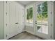 An entryway features wood-look floors, a large window, and a white door at 2202 Carlton Ct # 7, Atlanta, GA 30318